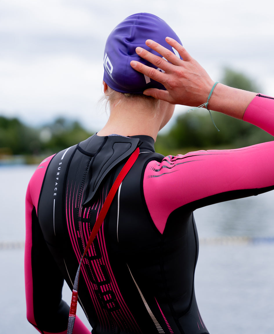 HUUB Surface Fluo Pink women's triathlon wetsuit lower body and leg panel detail