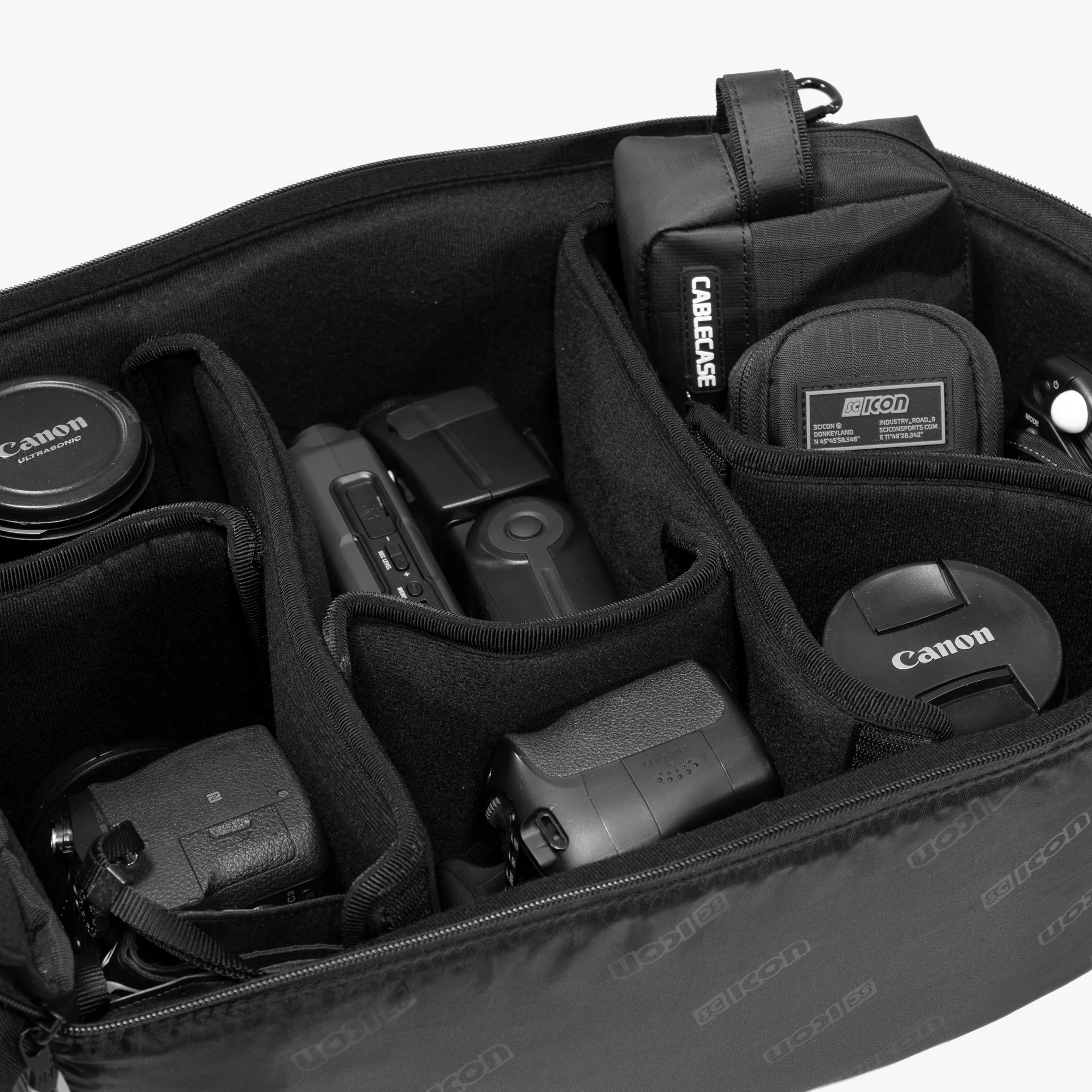 Scicon camera organizer insert designed for 35L backpack, with padded compartments for camera gear and accessories.